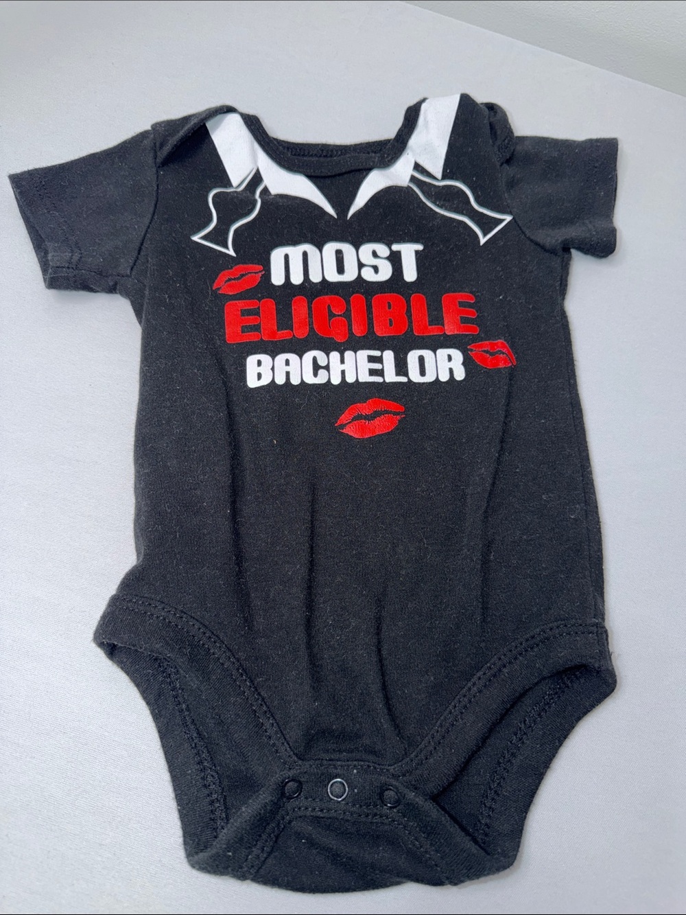 Most Eligible Bachelor Black Baby One-Piece Bodysuit